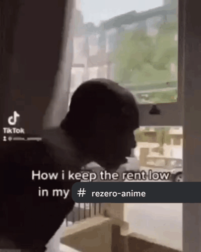 Man Standing In Front Of Window With Caption How I Keep Rent Low GIF
