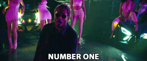 Man Standing in Front of Women with Number One