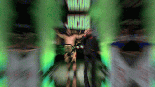 Man Standing in Front of Wood Jacob Sign