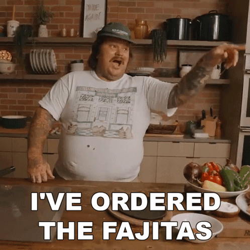 Man Standing in Kitchen With Words I've Ordered the Fajitas