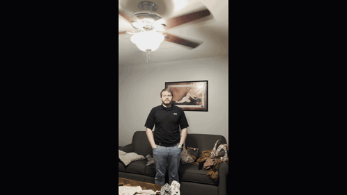 Man Standing in Living Room