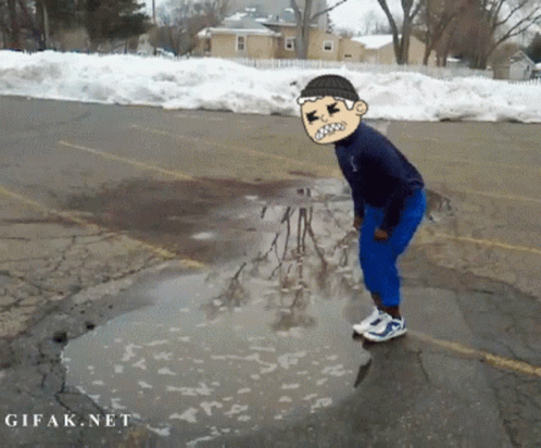 Man Standing in Puddle