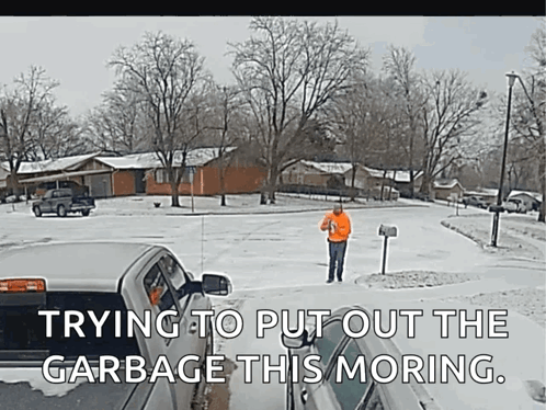 Man Standing in Snow Near Mailbox