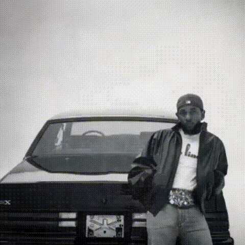 Man Standing Next to Black Car