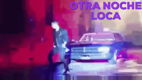 Man Standing Next to Police Car Otra Noche Loca