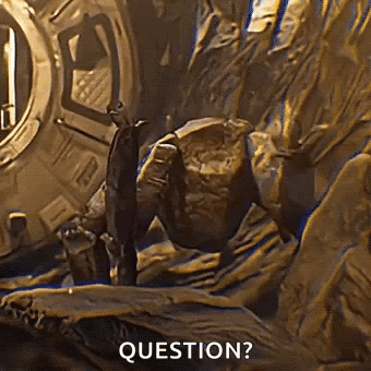 Man Standing Next to Rock Saying Question
