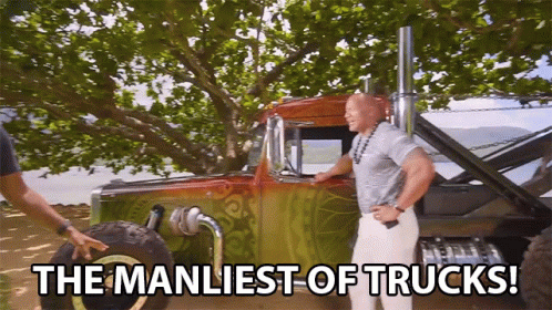 Man Standing Next to Truck Saying Manliest of Trucks