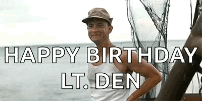 Man Standing on Boat With Happy Birthday Lt. Den