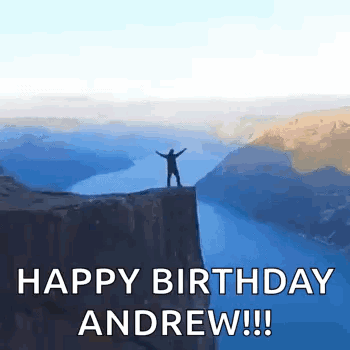 Man Standing on Cliff Overlooking Water