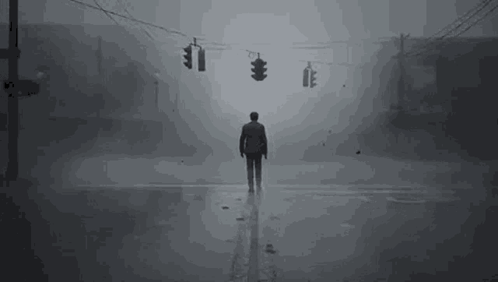 Man Standing on Foggy Street