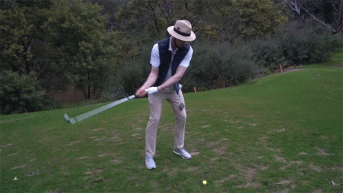 Man Standing on Golf Course Saying Hole in One