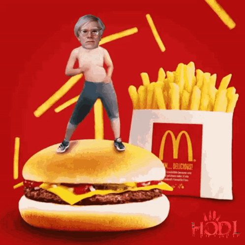 Man Standing on McDonald's Hamburger Next to French Fries