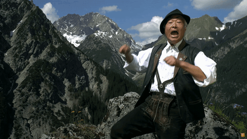 Man Standing on Rocky Mountain