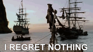 Man Standing on Sailboat Saying I Regret Nothing