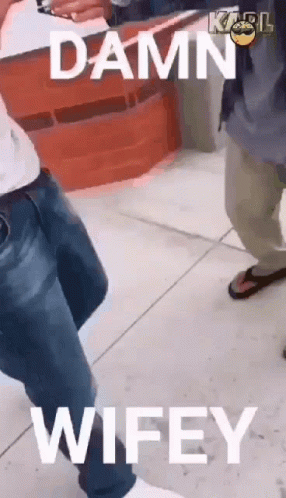 Man Standing on Sidewalk Damn Wifey