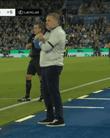 Man Standing on Soccer Field