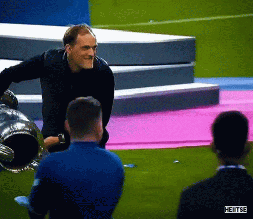 Man Standing on Soccer Podium