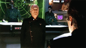 Man Stands in Front of Screen Saying XYZ