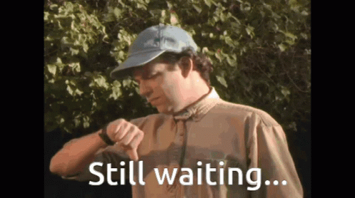 Man Staring At His Watch Still Waiting GIF