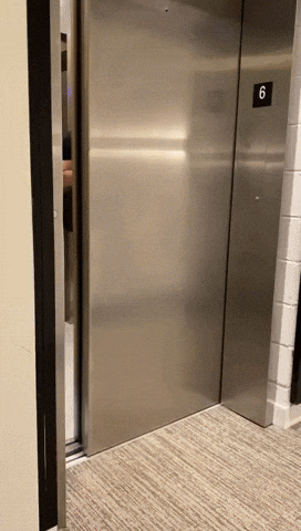 Man Stepping Out Of Elevator GIF