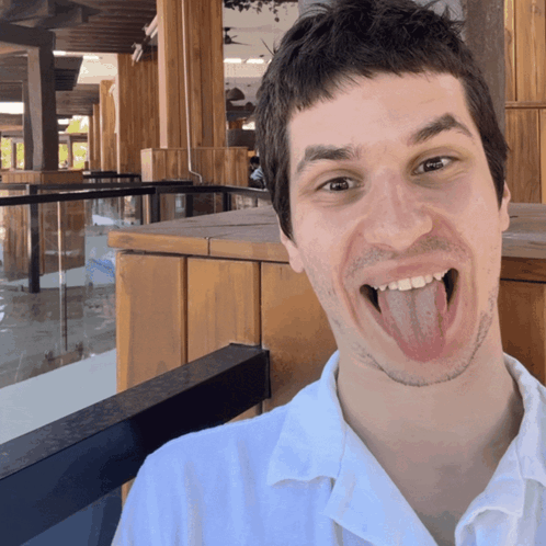 Man Sticking Tongue Out at Camera
