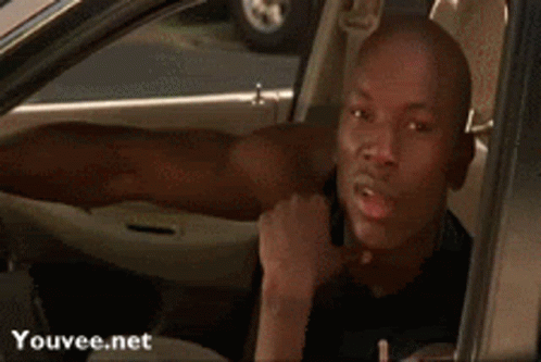 Man Sticking Tongue Out in Car