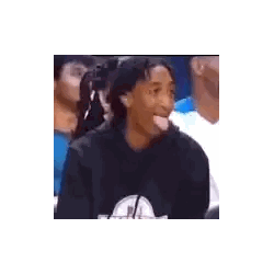 Man Sticking Tongue Out in Stadium