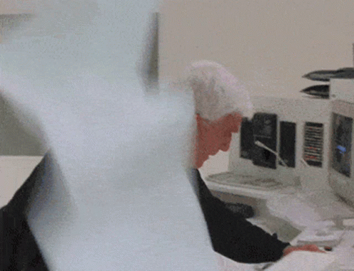 Man Stopping Paper Machine GIF