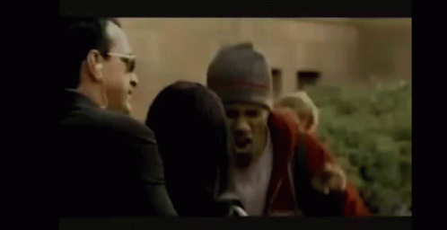 Man Suit Sunglasses Talk Woman Hat Man Watch GIF