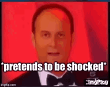 Man Suite Pretends To Be Shocked GIF