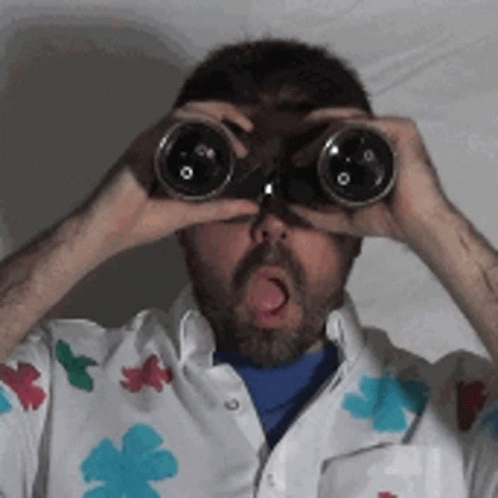 Man Surprised Looking At Binoculars GIF