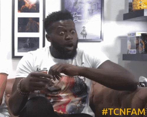Man Surprised Sitting On Couch GIF
