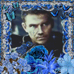 Man Surrounded by Blue Flowers and Butterflies