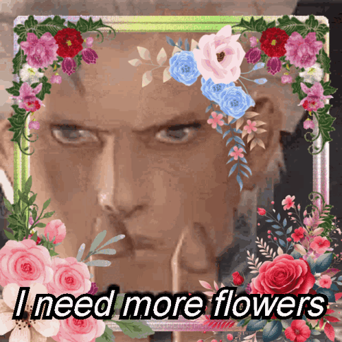 Man Surrounded By Flowers Saying I Need More Flowers GIF