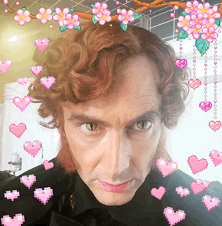 Man Surrounded by Hearts and Flowers