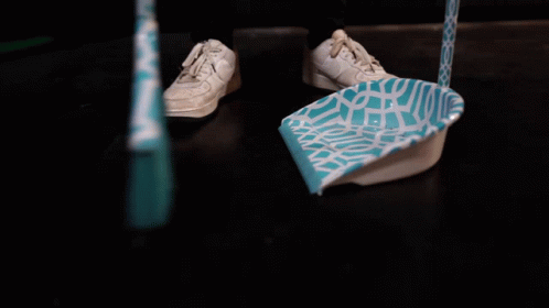 Man Sweep The Floor While Shaking His Head GIF