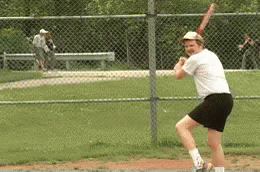 Man Swinging Baseball Bat At Ball GIF