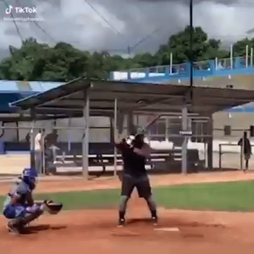 Man Swinging Baseball Bat