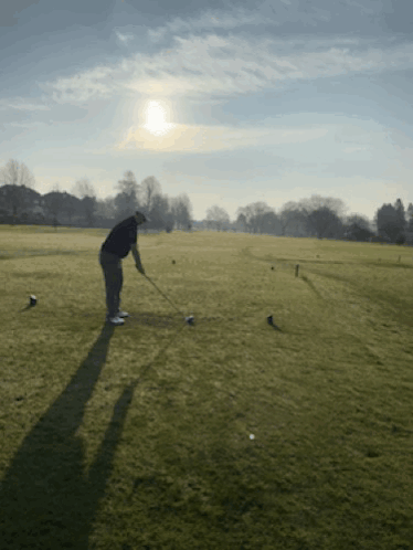 Man Swinging Golf Club GIF