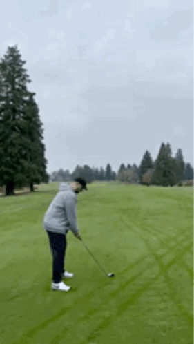 Man Swinging Golf Club GIF