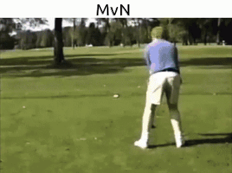 Man Swinging Golf Club at Golf Ball