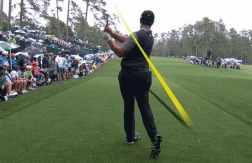 Man Swinging Golf Club
