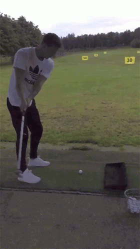 Man Swinging Golf Club With 30 Sign
