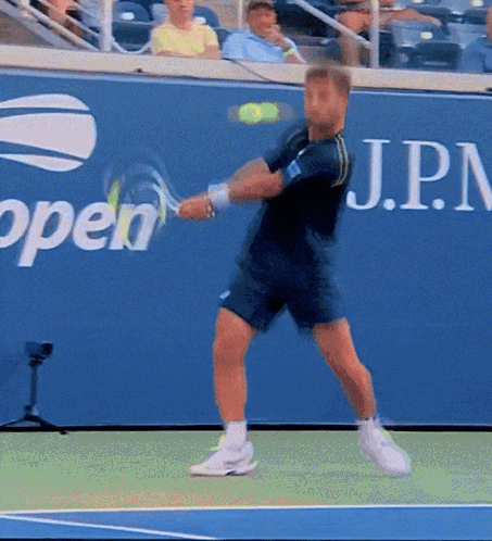 Man Swinging Tennis Racket GIF