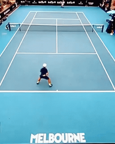Man Swinging Tennis Racket with 1573 Sign