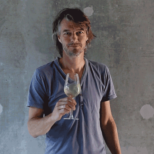 Man Swirl And Smell White Wine GIF