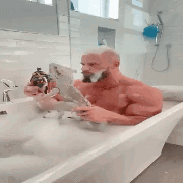 Man Taking Bath in Bathtub