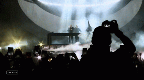 Man Taking Photo at Concert Campbella