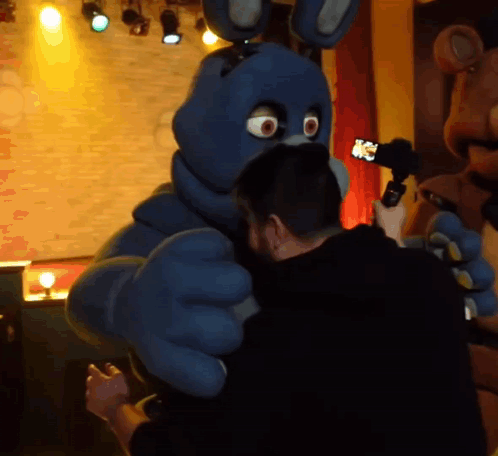 Man Taking Picture of Bonnie the Bunny With Cell Phone
