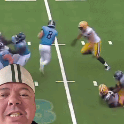 Man Taking Picture Of Football Player In Number 79 Jersey GIF